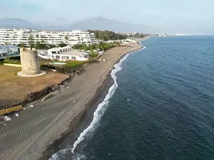 Marbella Prints: aerial view of the beach of linda vista next to the tower of las bóvedas in the municipality of Marbella