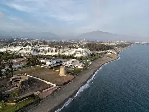 aerial view of the beach of linda vista next to the tower of las bóvedas in the municipality of Marbella, Andalusia