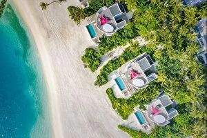 Images Dated 11th December 2018: Aerial view of beach luxury villas of Indian Ocean. Summer holiday tropical landscape with palm