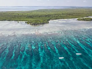 An aerial view of a beautiful coral reef on the edge of Turneffe Atoll off the coast of Belize. This area of the Caribbean is extremely biodiverse