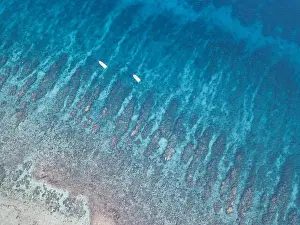 An aerial view of a beautiful coral reef on the edge of Turneffe Atoll off the coast of Belize. This area of the Caribbean is extremely biodiverse