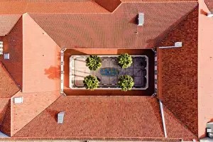 Aerial view of a beautiful courtyard with porch and palm trees in a catholic school and convent in Lisbon, Portugal