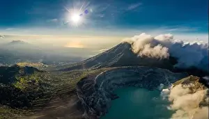 Active Volcano Prints: Aerial view of beautiful Ijen volcano with acid lake and sulfur gas going from crater