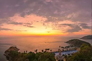 Promontory Prints: Aerial view of beautiful sky The sun reflects off the sea at Laem Phromthep Viewpoint at sunset