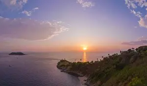 Promontory Prints: Aerial view of beautiful sky The sun reflects off the sea at Laem Phromthep Viewpoint at sunset
