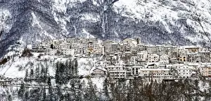 Snowcapped Prints: Aerial view of the beautiful snow-covered village of Opi with snow-capped mountains in the background