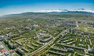 City Landscape Prints: Aerial view of Bishkek city Kyrgyzstan with snow-capped mountains