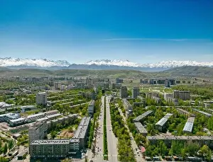 Kyrgyzstan Prints: Aerial view of Bishkek city Kyrgyzstan with snow-capped mountains
