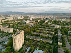 City Landscape Prints: Aerial view of Bishkek city Kyrgyzstan with snowy mountains in the background