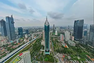 Aerial view of BNI 46 building in Jakarta and noise cloud with cityscape