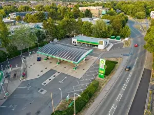 Aerial view of BP petrol station showing high UK fuel price sign