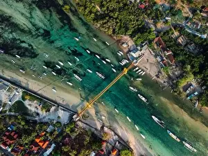 Speedboat Prints: Aerial view of a bridge connecting two tropical islands over a narrow ocean channel