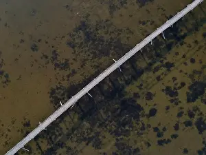 Seafloor Prints: Aerial view of Bridge over a lake. Drone photo