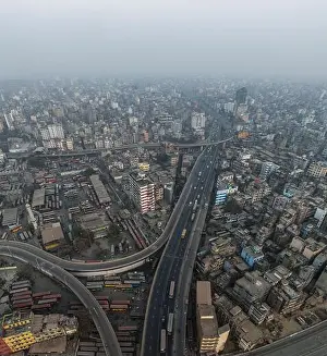 Intersection Prints: Aerial view of bustling cityscape with dense buildings and busy roads