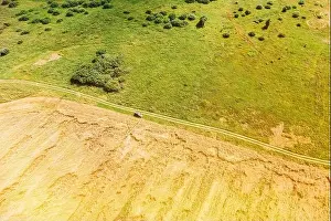 Aerial View Of Car SUV Parked Near Countryside Road In Summer Field Rural Landscape. Yellow Wheat Field In Summer Season