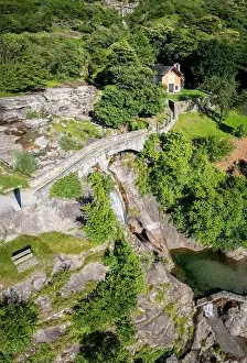 Stone Bridge Prints: Aerial view of the church and waterfall of Santa Petronilla located in Biasca town