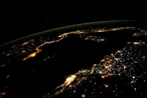 City Lights Prints: Aerial view, cities light up the night view from space