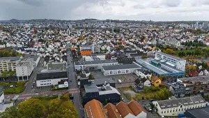 Industrial Area Prints: Aerial view of a city with residential houses and industrial buildings
