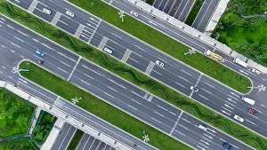 Expressway Prints: Top down aerial view of the clover like road junction in Chinese city Chengdu