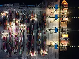 Cargo Transport Prints: Aerial view of Container ship loading and unloading in deep sea port