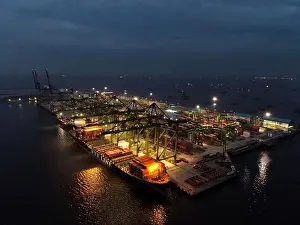 Cargo Transport Prints: Aerial view of Container ship loading and unloading in deep sea port