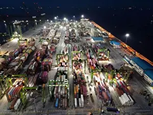 Cargo Transport Prints: Aerial view of Container ship loading and unloading in deep sea port