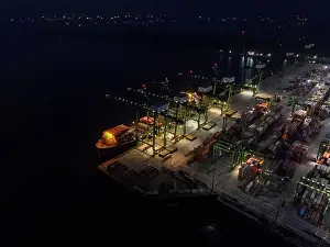 Cargo Transport Prints: Aerial view of Container ship loading and unloading in deep sea port