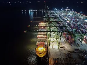 Cargo Transport Prints: Aerial view of Container ship loading and unloading in deep sea port