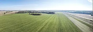 aerial view of a country road between agricultural fields. wide panorama