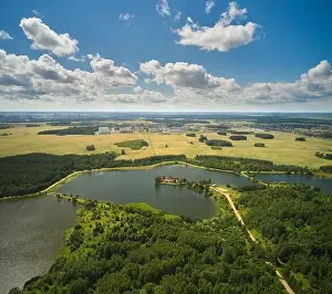 Drone Landscape Prints: Aerial view of country road in green summer forest and blue lake