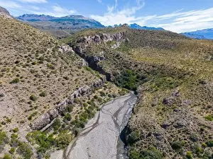 Aerial view of a creek running through the gorge of Quebrada El Diablo in Chile - Traveling on the Carretera Austral