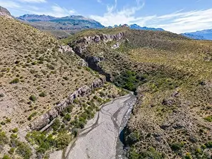 Aerial view of a creek running through the gorge of Quebrada El Diablo in Chile - Traveling on the Carretera Austral
