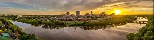 Higher Education Prints: Aerial view of downtown New Brunswick and Rutgers University as the sun sets behind the high rise buildings
