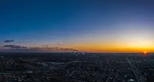 Reddish Prints: Aerial view from drone. Aerial view amazing sunset over of the suburbs with the city
