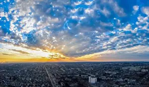 Aerial view from drone. Aerial view amazing sunset over of the suburbs with the city, far villages and fields