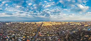 Aerial view from drone. Aerial view amazing sunset over of the suburbs with the city, far villages and fields