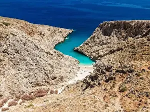 Chania Prints: Aerial top view by drone of beach of Seitan Limania in bay with turquoise water and an unusual shape in Akrotiri