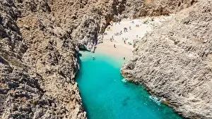 Aerial top view by drone of beach of Seitan Limania in bay with turquoise water and an unusual shape in Akrotiri, Crete