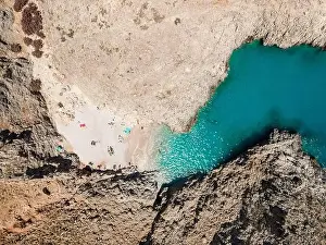 Chania Prints: Aerial top view by drone of beach of Seitan Limania in bay with turquoise water and an unusual shape in Akrotiri