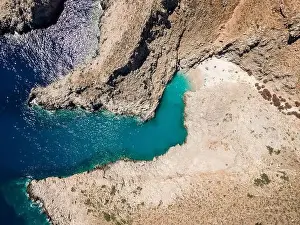 Aerial top view by drone of beach of Seitan Limania in bay with turquoise water and an unusual shape in Akrotiri, Crete
