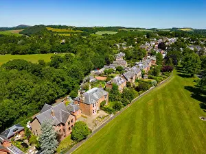 Homes Prints: Aerial view from drone of row of large detached villas in village of St Boswells in Scottish Borders