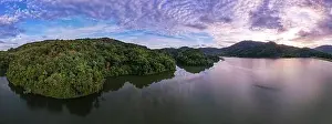Spring River Prints: Aerial view drone shot of panorama abundant rainforest Sunset or sunrise sky over lake