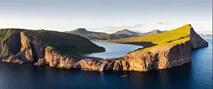 Aerial view from drone of Sorvagsvatn lake on cliffs of Vagar island in sunset time, Faroe Islands, Denmark. Landscape photography