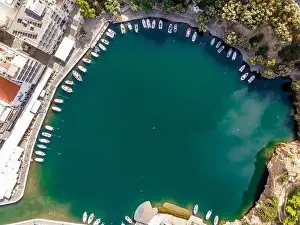 Agios Nikolaos Prints: Aerial top view by drone of Voulismeni Lake in Agios Nikolaos city. Greece, Crete