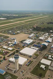 Sky Travel Prints: An aerial view of EAA Airventure grounds with planes and tents