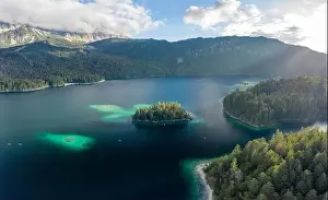 Garmisch Prints: Aerial view of Eibsee lake island tree by Zugspitze before sunset in Germany