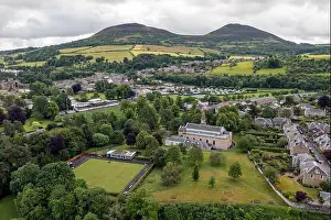 Scotland Prints: Aerial view of the Eildon Hills and Melrose town centre on the banks of the River Tweed