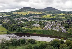 Scotland Prints: Aerial view of the Eildon Hills and Melrose town centre on the banks of the River Tweed