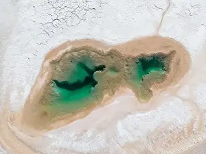 Brownish Prints: Aerial view of the famous tourist attraction Ojos del Mar near Tolar Grande in the Argentinian highlands called Puna