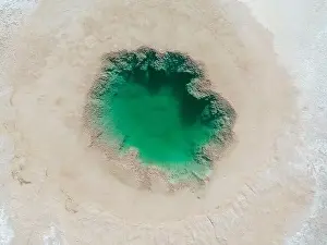 Aerial view of the famous tourist attraction Ojos del Mar near Tolar Grande in the Argentinian highlands called Puna in